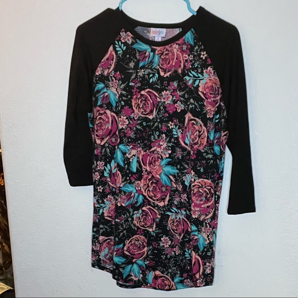 Size small randy with black arms and roses on body